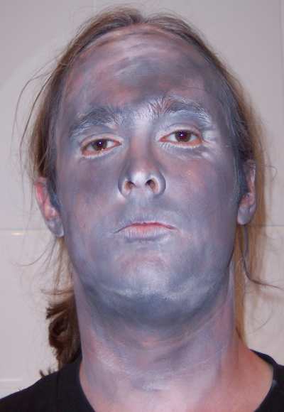 A example of Stoneface Elf facepaint, a mixture of black and white facepaint creating a grey effect.